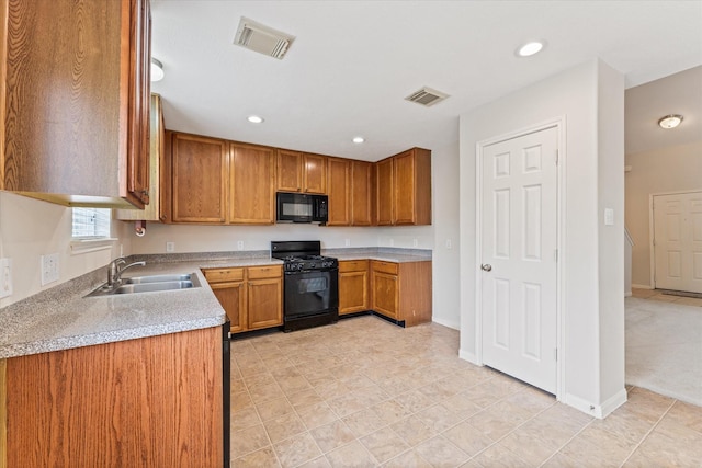 kitchen featuring black appliances and sink