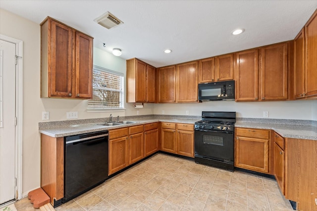 kitchen with black appliances and sink