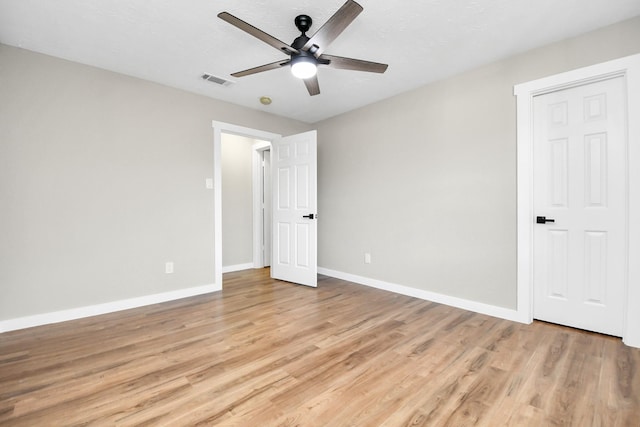 unfurnished bedroom featuring ceiling fan and light wood-type flooring