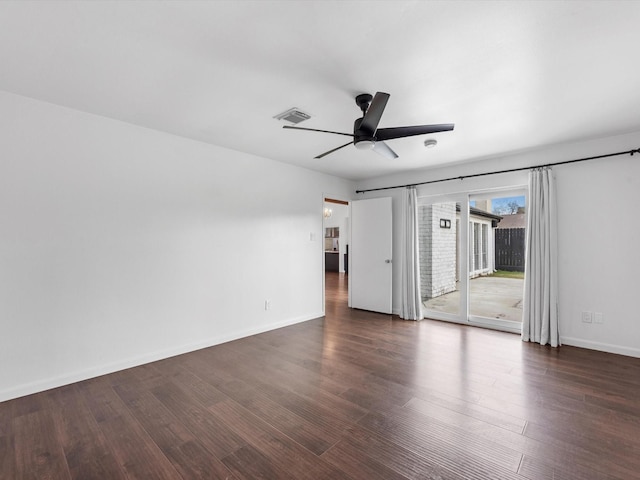 unfurnished room with ceiling fan and dark hardwood / wood-style flooring