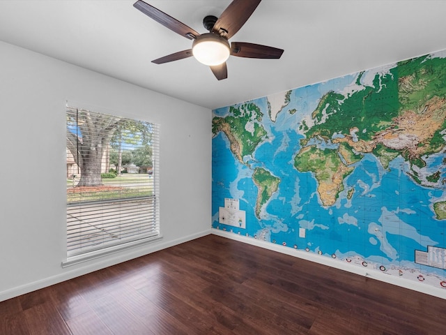 empty room featuring ceiling fan and wood-type flooring