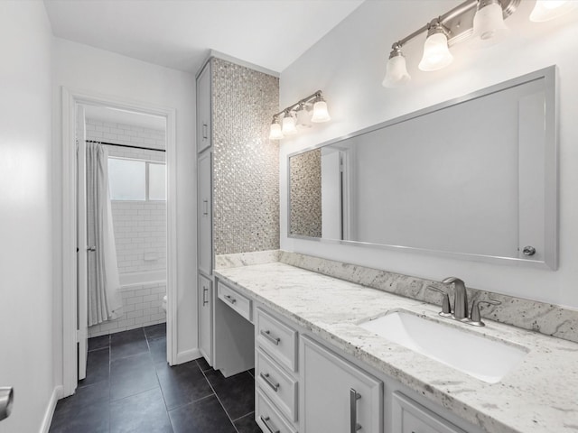 bathroom featuring tile patterned flooring, shower / bath combination with curtain, and vanity