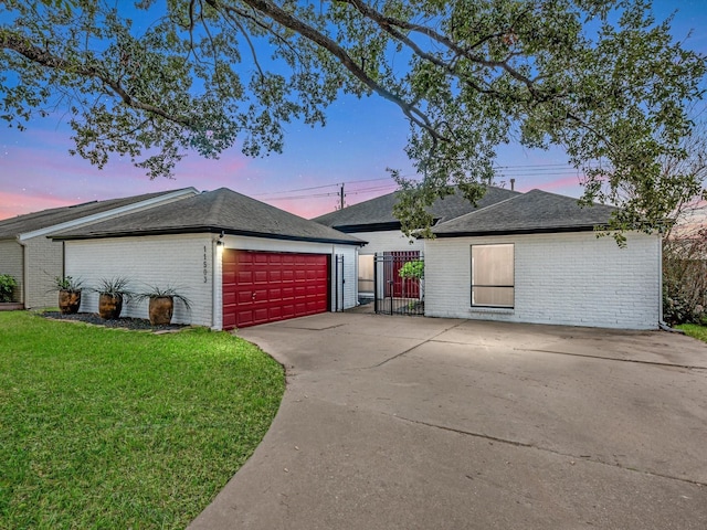 ranch-style home with a lawn