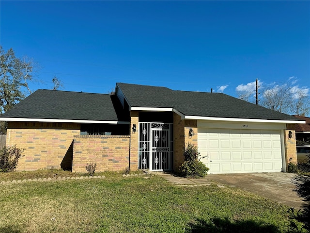 ranch-style home with a front yard and a garage