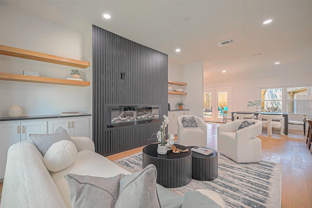 living room with light hardwood / wood-style floors