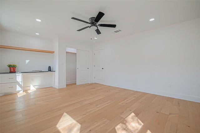 interior space with light hardwood / wood-style floors and ceiling fan