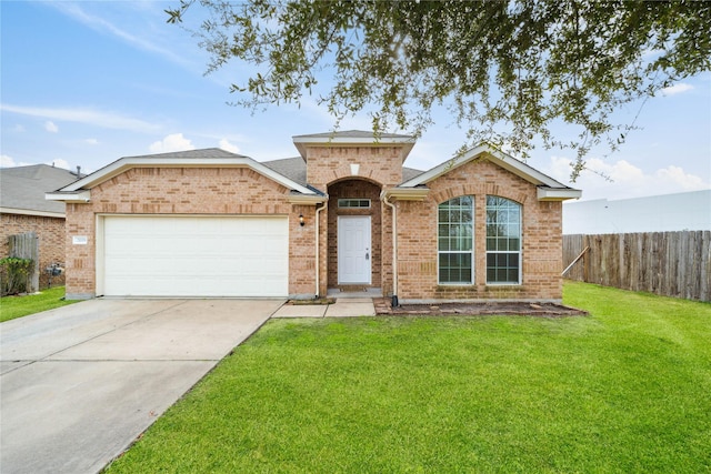 single story home featuring a garage and a front lawn