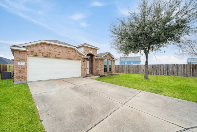 single story home featuring a front lawn, a garage, and central air condition unit