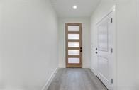 entryway with light hardwood / wood-style flooring