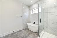 bathroom with shower with separate bathtub