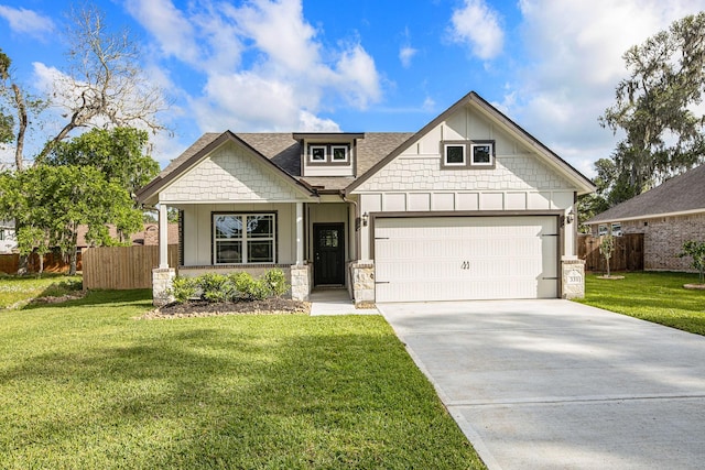 craftsman-style house featuring a garage and a front yard