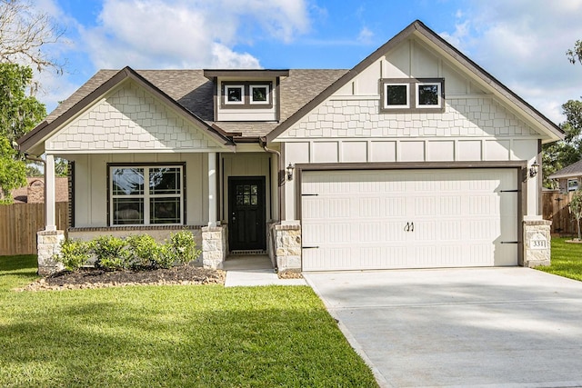 view of front of home featuring a front lawn and a garage