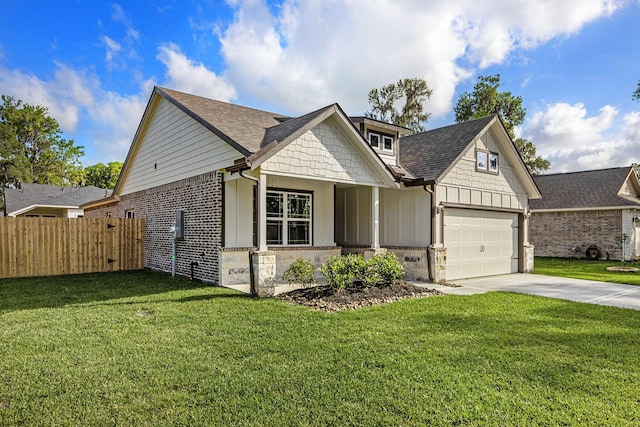 view of front of property featuring a front yard and a garage