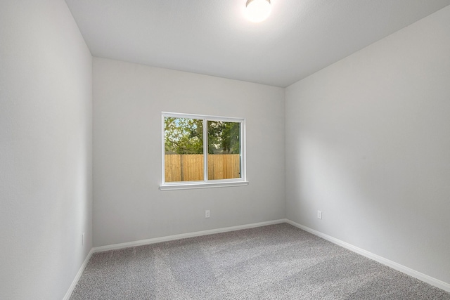 unfurnished room with carpet flooring