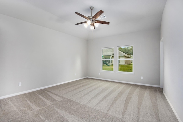 carpeted empty room featuring ceiling fan