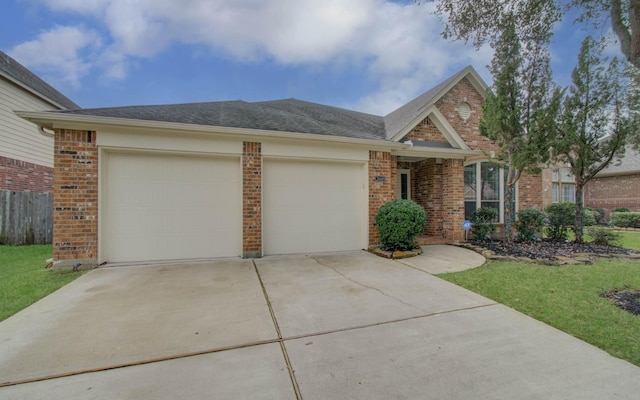 single story home featuring a front yard and a garage