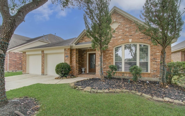 view of front of property with a front lawn and a garage