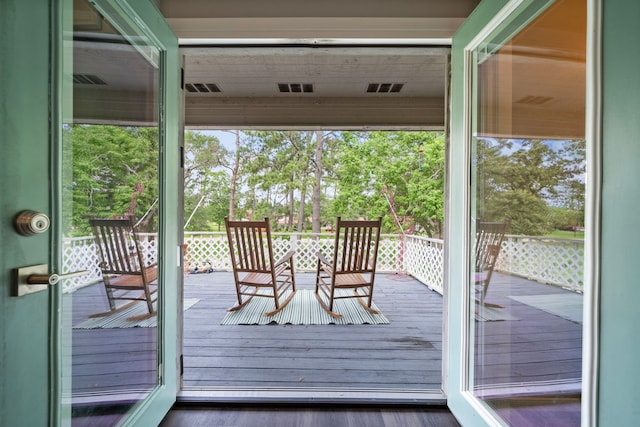 doorway to outside with dark wood-type flooring