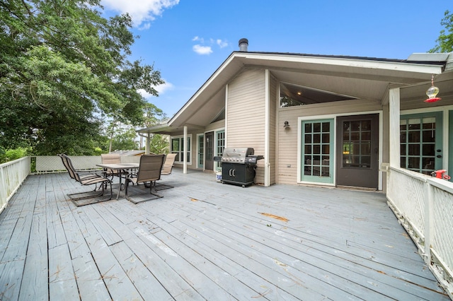 wooden terrace with area for grilling