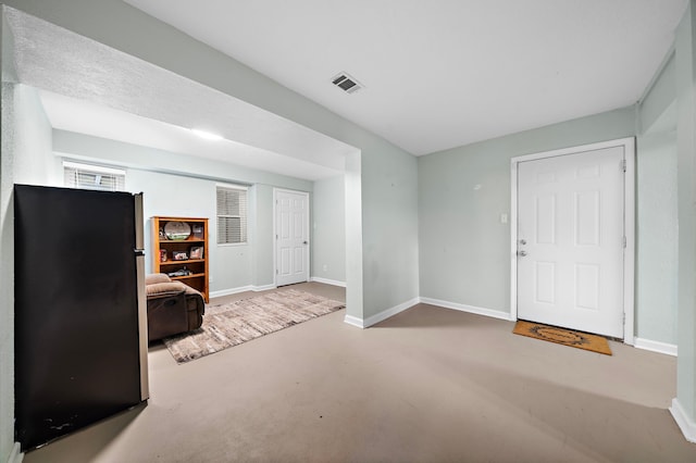 interior space featuring concrete flooring