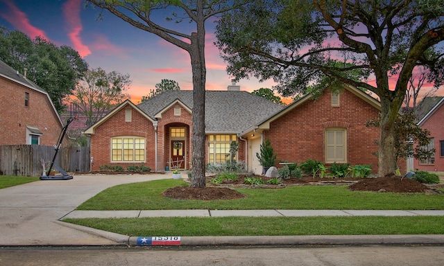 view of front of property with a yard