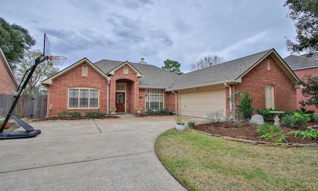 view of front of home with a front yard and a garage