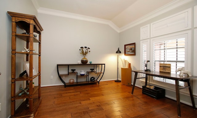 interior space with vaulted ceiling, dark wood-type flooring, and ornamental molding