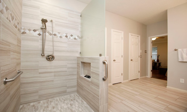 bathroom featuring tiled shower