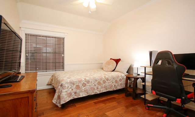 bedroom with ceiling fan, dark wood-type flooring, lofted ceiling, and ornamental molding