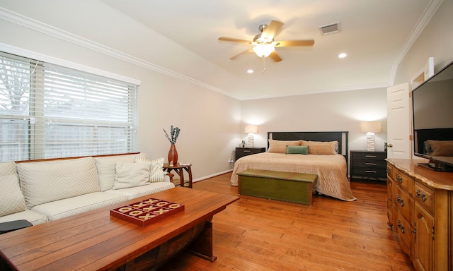 bedroom with ceiling fan, light hardwood / wood-style flooring, and ornamental molding