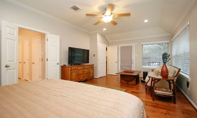 bedroom with ceiling fan, hardwood / wood-style flooring, crown molding, and vaulted ceiling