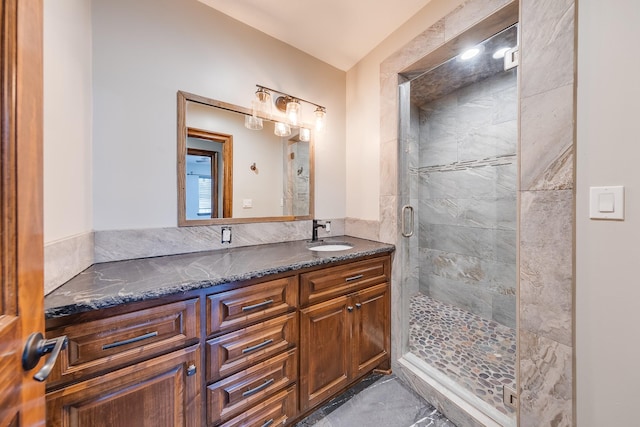 bathroom featuring an enclosed shower and vanity