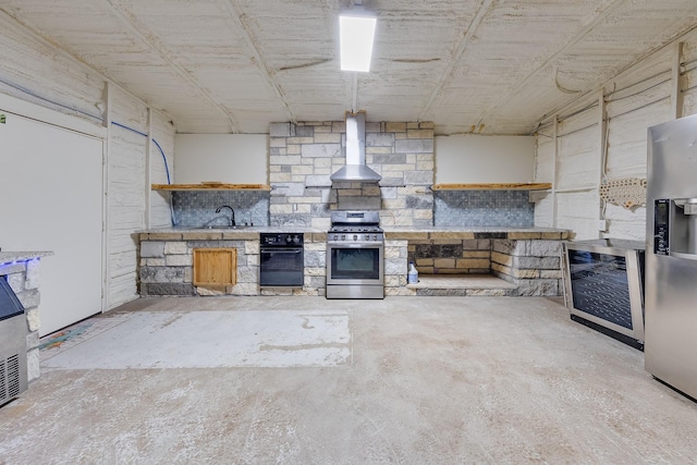 kitchen featuring decorative light fixtures, wine cooler, extractor fan, sink, and appliances with stainless steel finishes