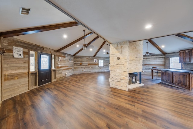 interior space with ceiling fan, dark hardwood / wood-style floors, and lofted ceiling with beams