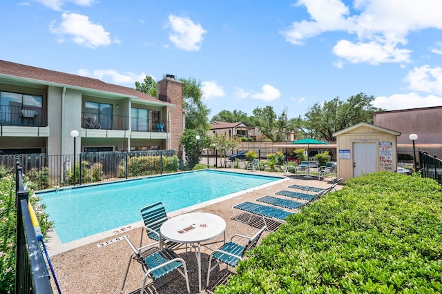 view of swimming pool with a patio area