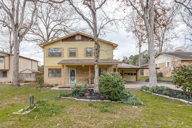 view of front facade with a garage and a front yard