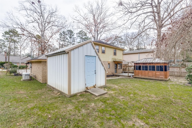 view of outbuilding with a lawn