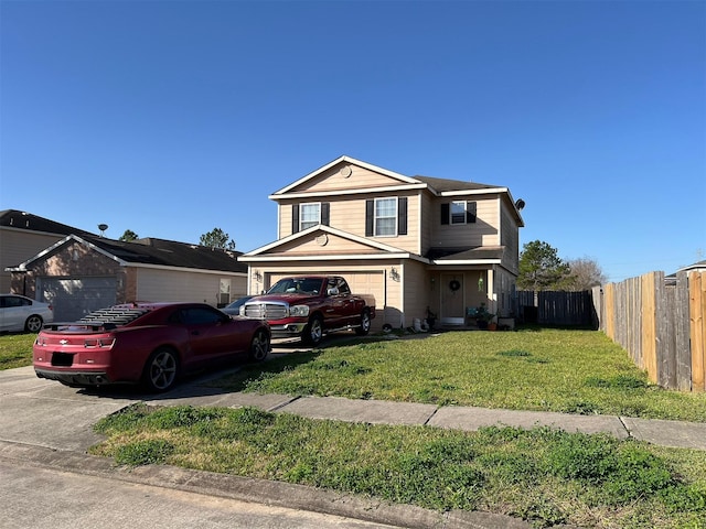 view of property with a garage and a front yard