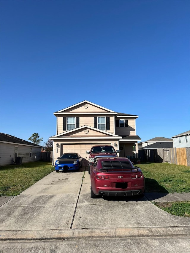 view of front of house with a garage, a front yard, and central AC