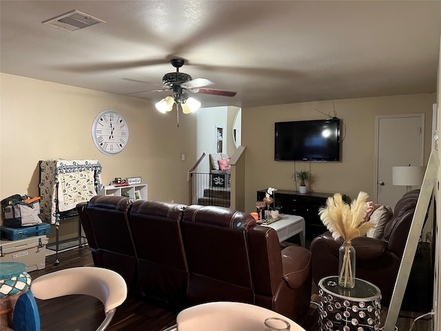 living room featuring ceiling fan and wood-type flooring