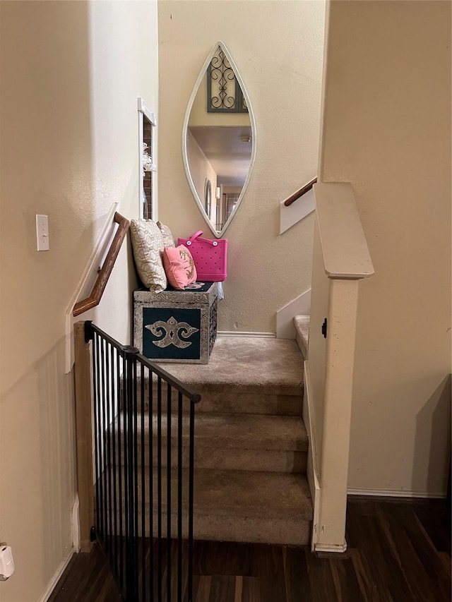 staircase featuring hardwood / wood-style flooring