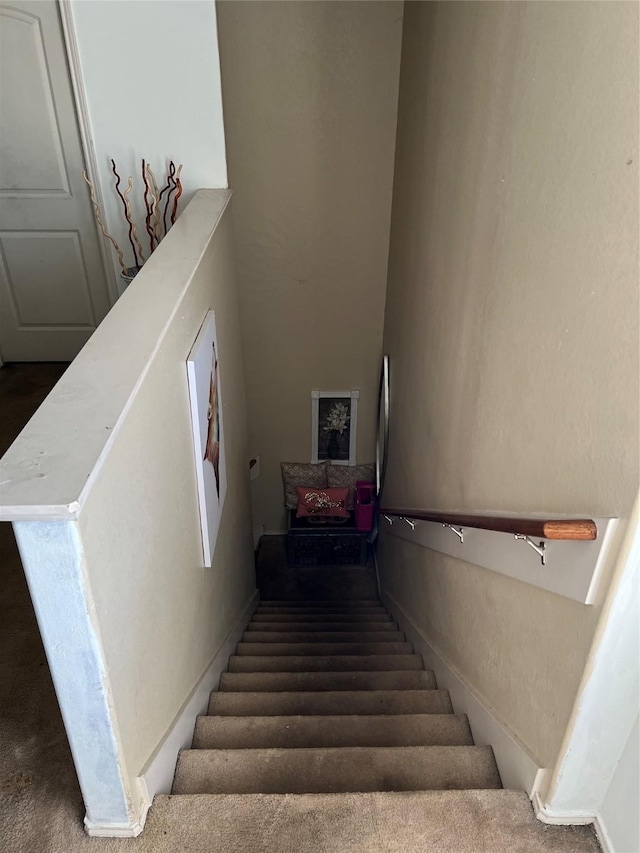 staircase with carpet