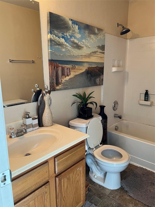 full bathroom featuring toilet, vanity, and washtub / shower combination