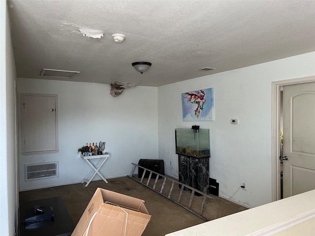 living room with a textured ceiling