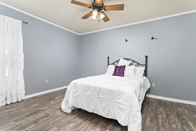 bedroom featuring ceiling fan, dark hardwood / wood-style flooring, and ornamental molding