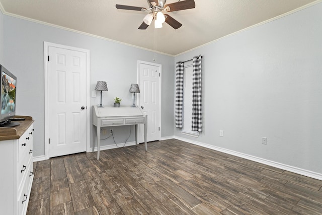 unfurnished office with ceiling fan, dark hardwood / wood-style flooring, and ornamental molding