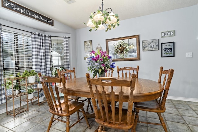 dining area featuring a notable chandelier