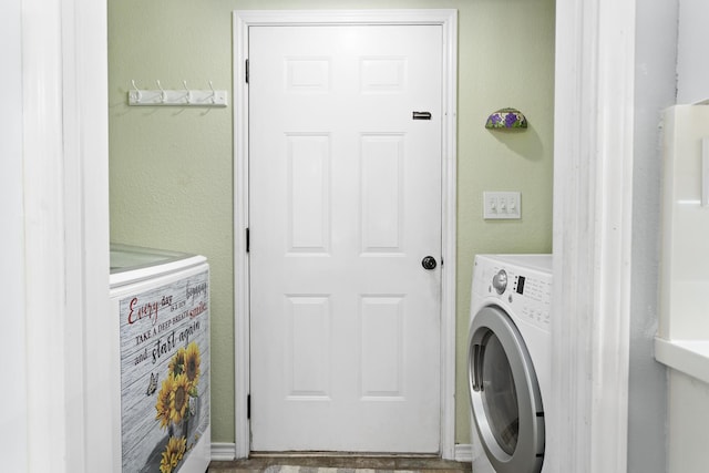 clothes washing area featuring washer / clothes dryer