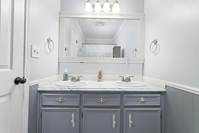 bathroom featuring vanity, crown molding, and a shower with shower curtain