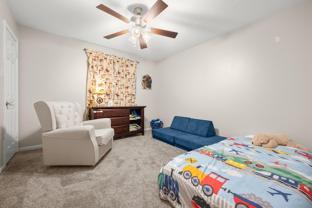 bedroom with light carpet and ceiling fan